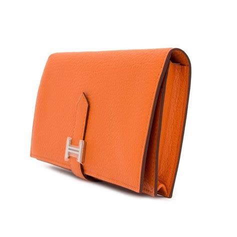 hermes orange wallet.